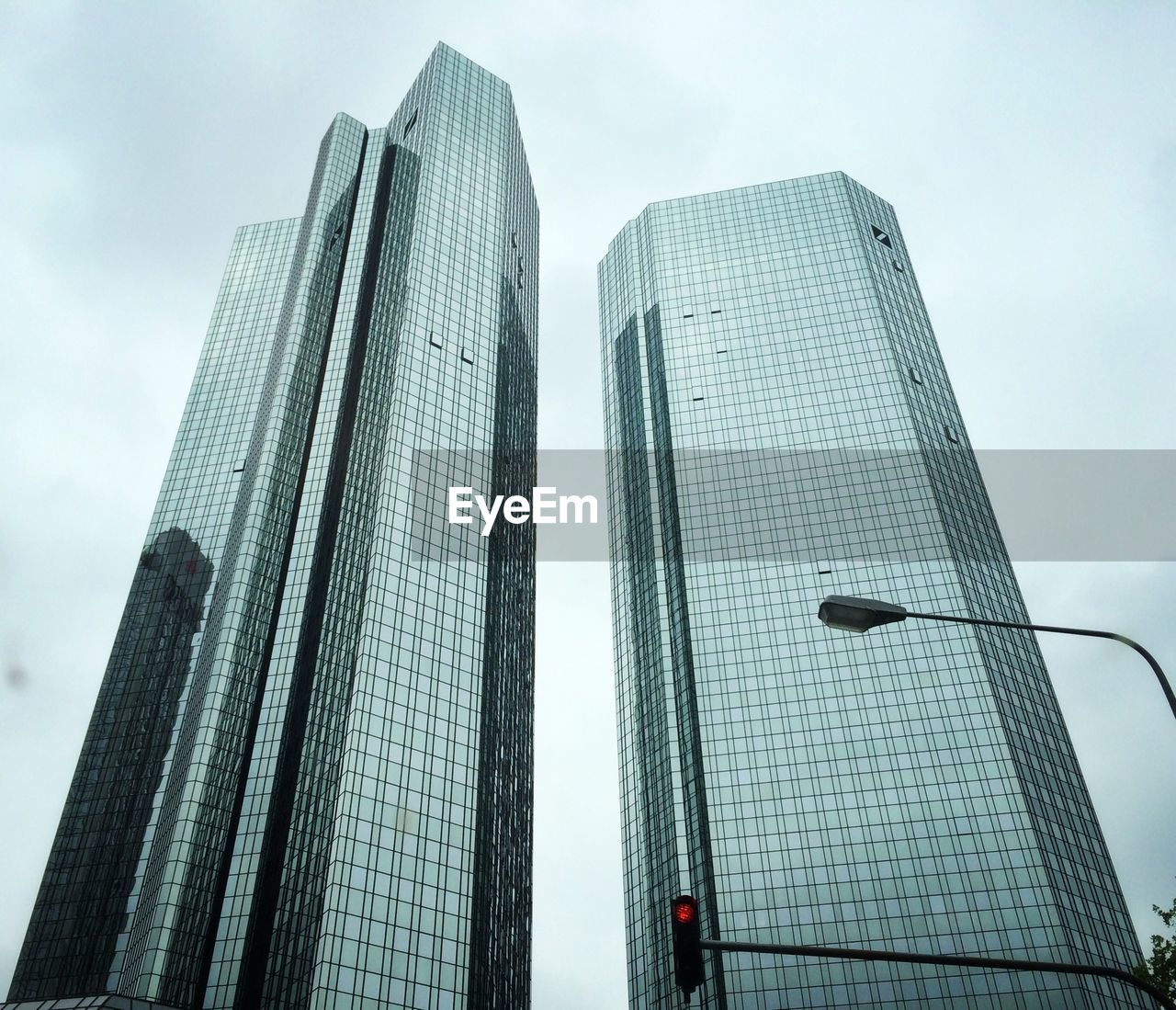 Low angle view of modern buildings in city against sky