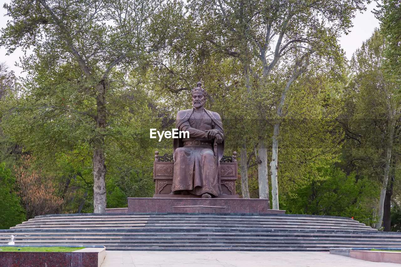 tree, plant, sculpture, statue, architecture, memorial, human representation, representation, nature, male likeness, no people, religion, travel destinations, history, the past, park, craft, day, travel, outdoors, park - man made space, tourism, belief, monument, spirituality, creativity, built structure