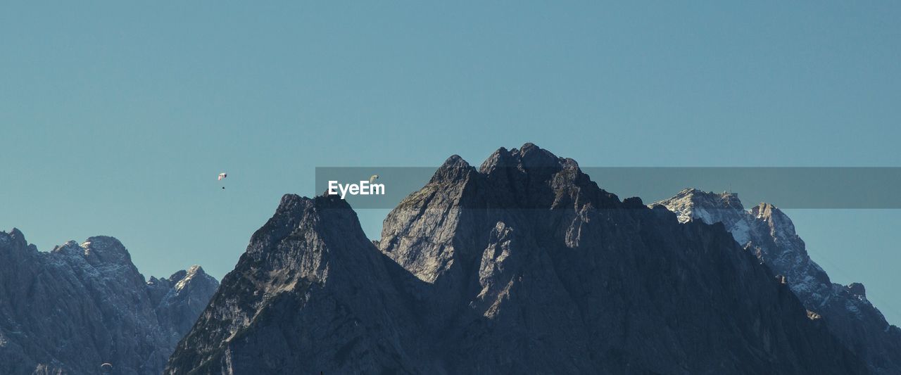 Scenic view of zugspitze mountain against clear blue sky