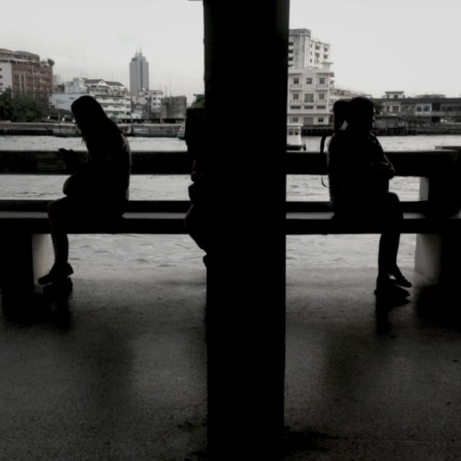 WOMAN WALKING ON FOOTBRIDGE