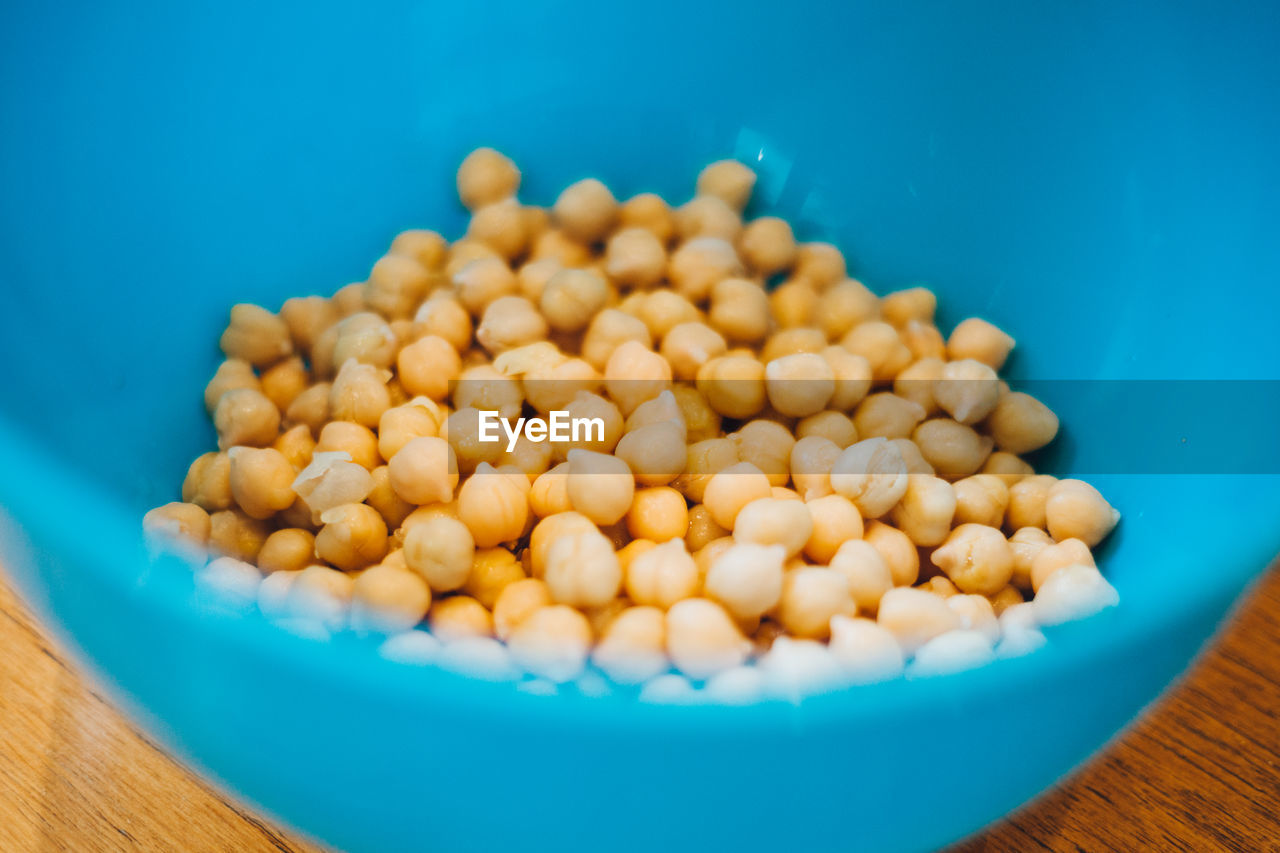 High angle view of chick-peas in blue bowl