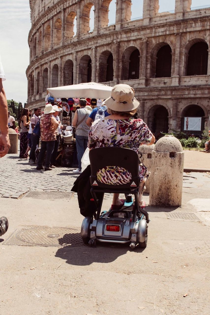 TOURISTS IN THE COURTYARD OF COLISEUM
