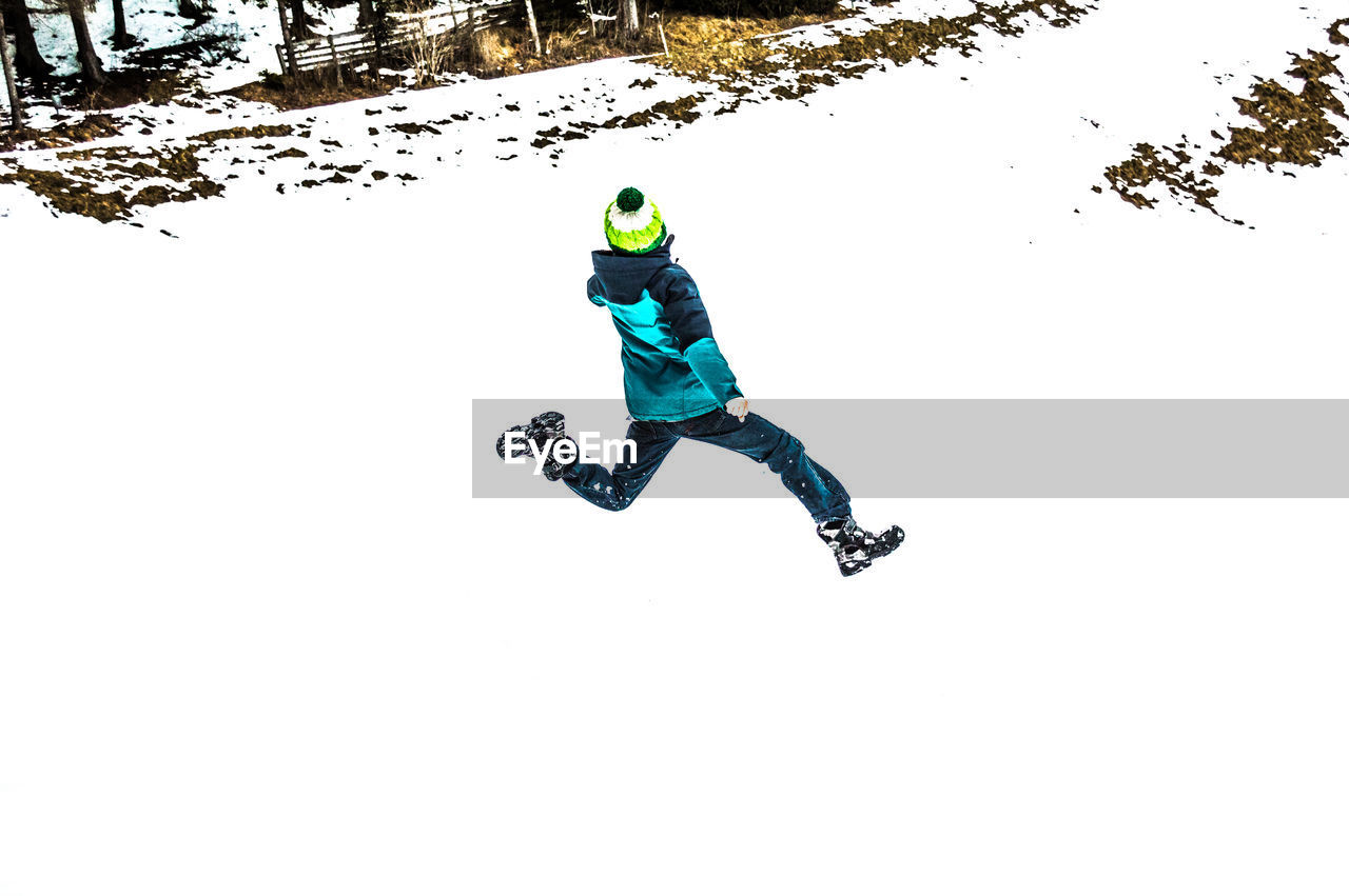 FULL LENGTH OF MAN WITH SNOW