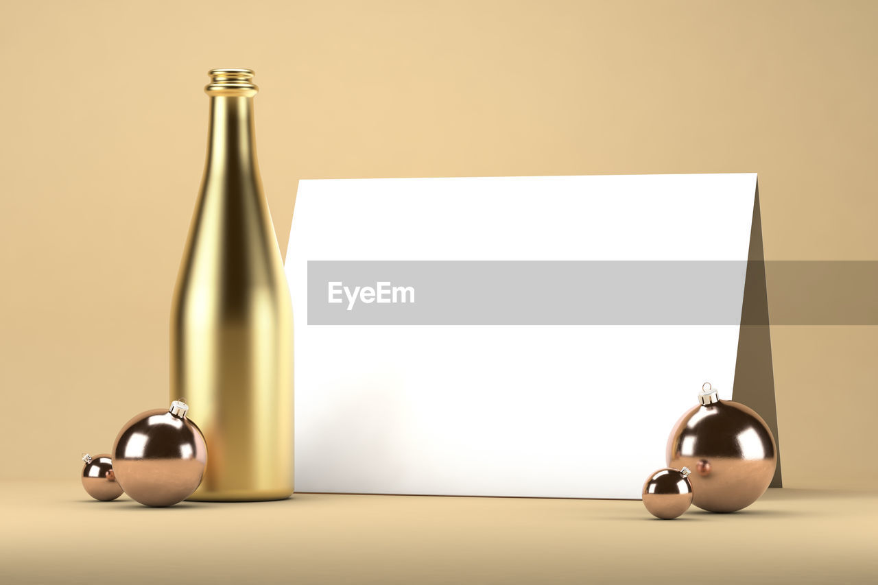 New years invitation mockup with bottle of champagne and christmas balls