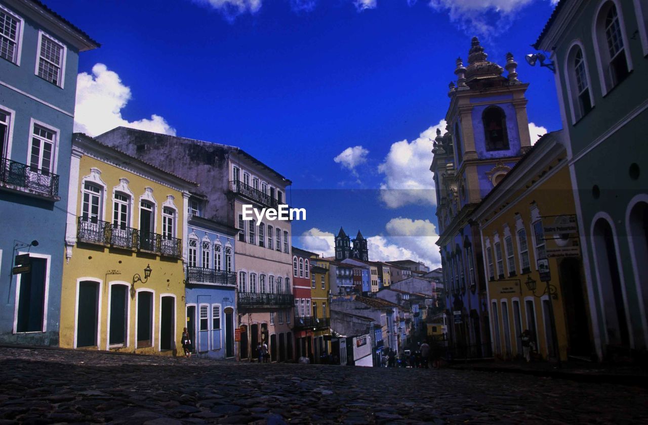 Street amidst buildings against sky