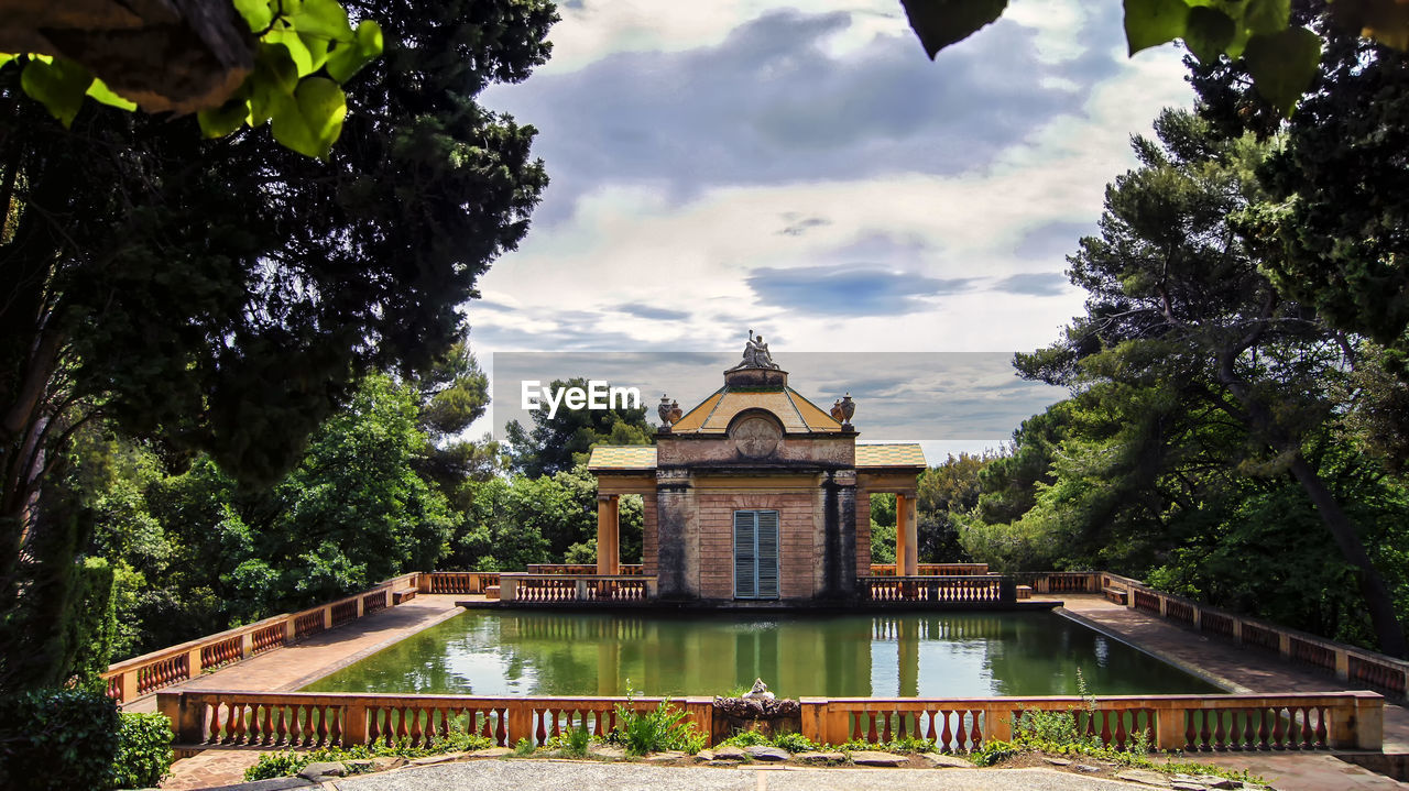 Pond in front of mansion