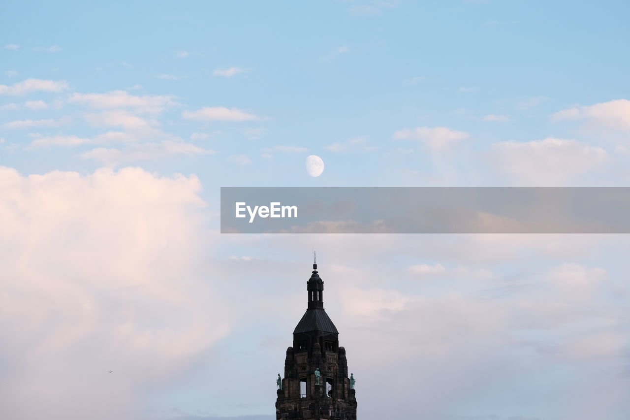 High section of building against cloudy sky