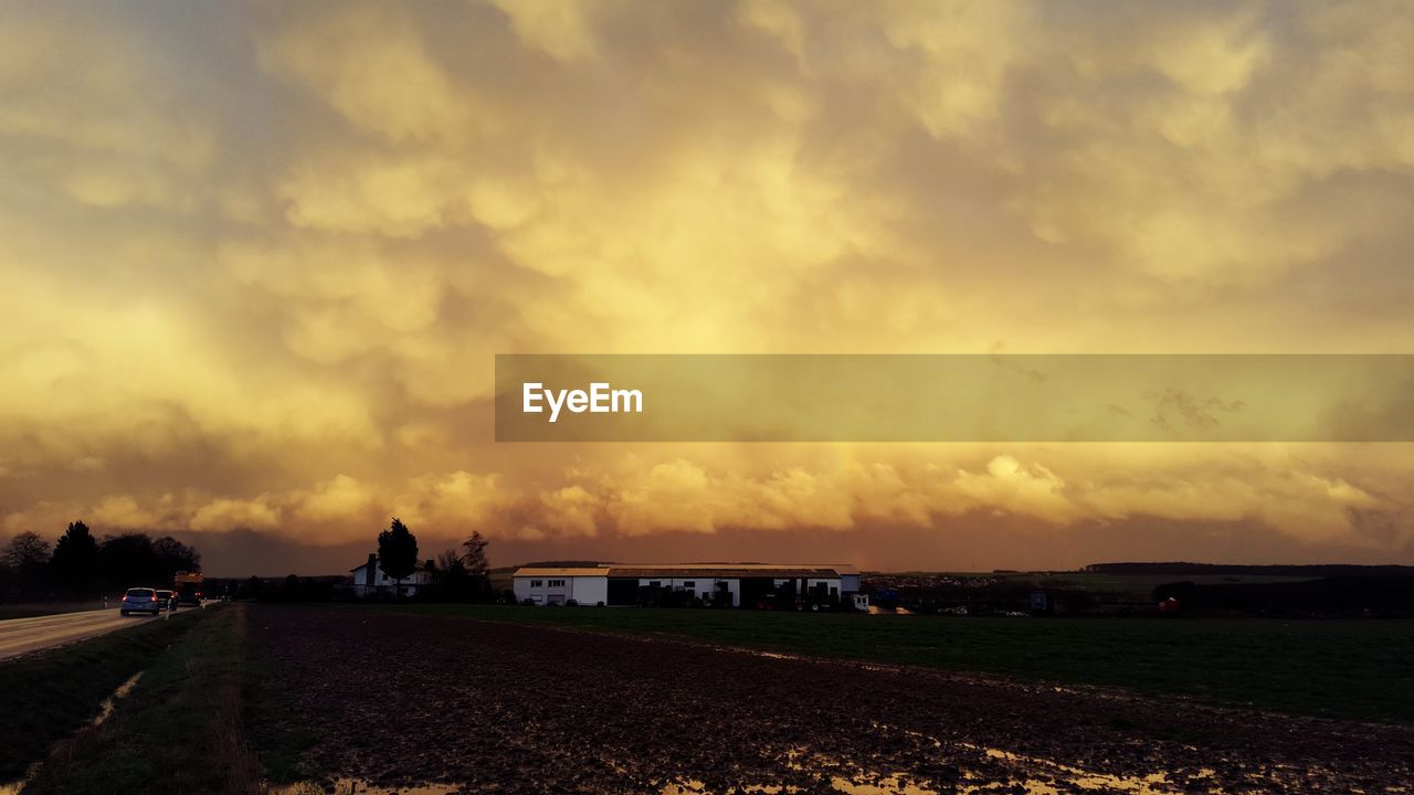 Scenic view of landscape against cloudy sky