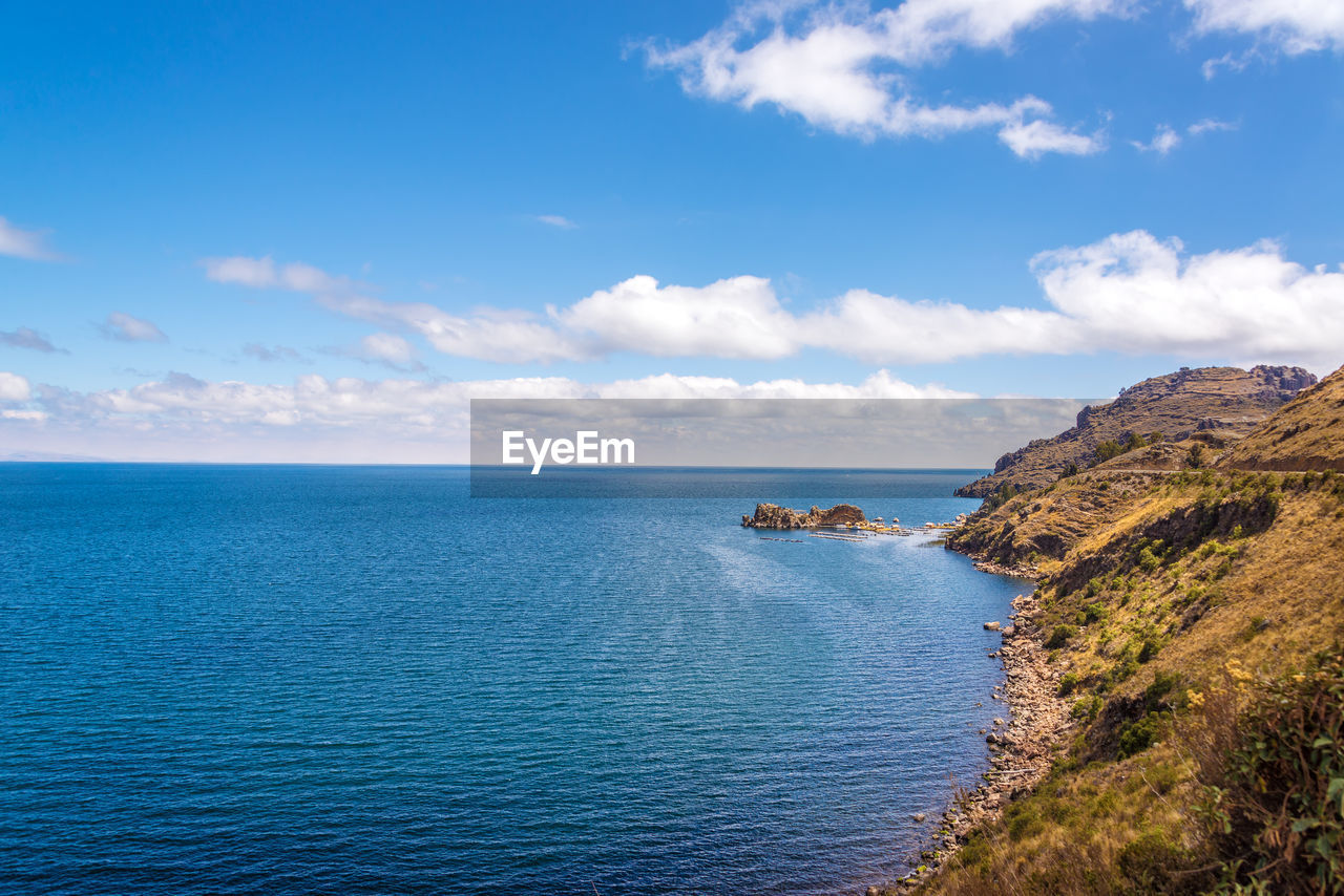 Scenic view of lake titicaca against sky