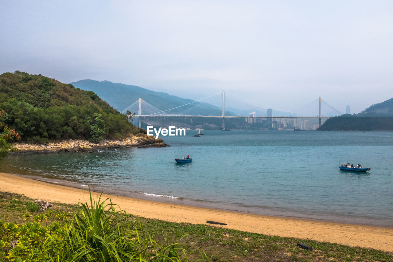 View of suspension bridge over sea