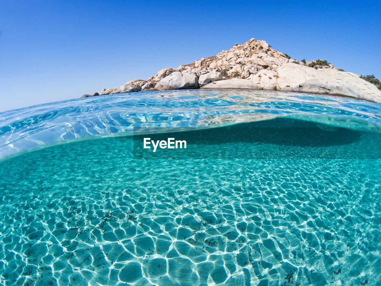 SWIMMING POOL IN SEA AGAINST CLEAR BLUE SKY