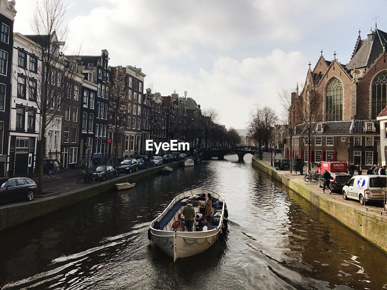 VIEW OF BOATS IN CANAL ALONG CITY