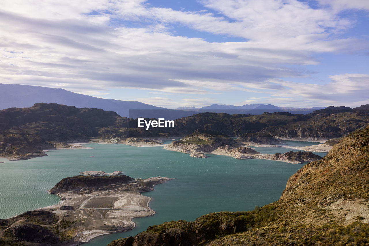 Scenic view of sea against cloudy sky