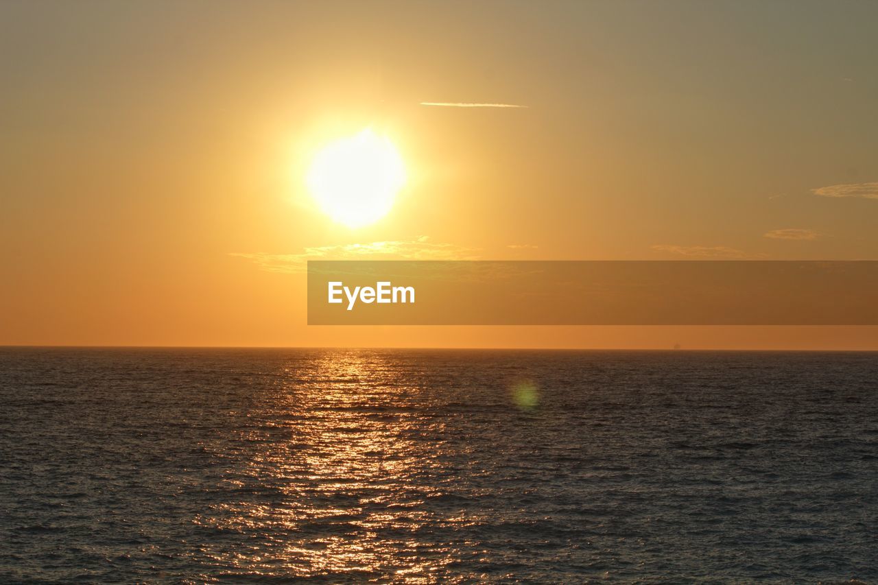 SCENIC VIEW OF SEA DURING SUNSET