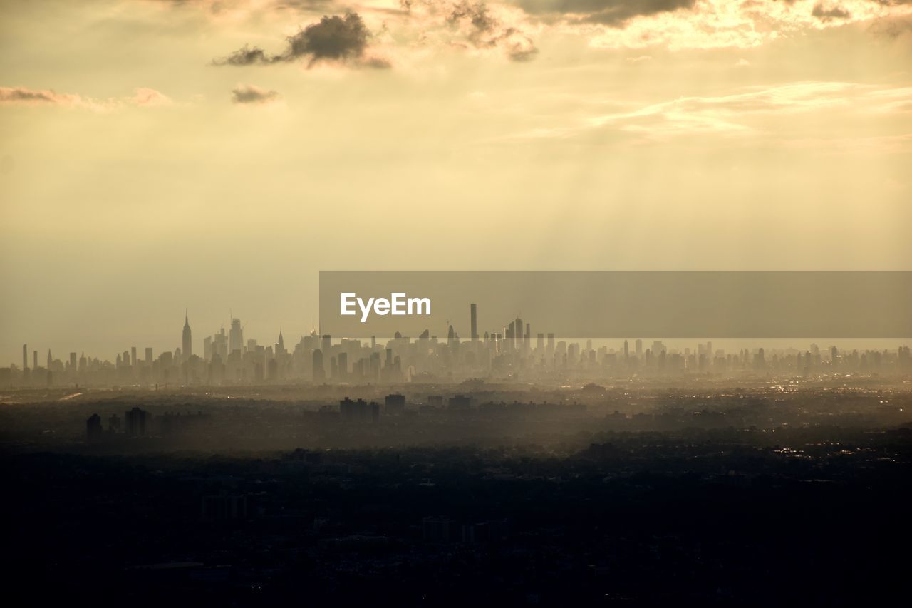 PANORAMIC VIEW OF CITY BUILDINGS DURING SUNSET