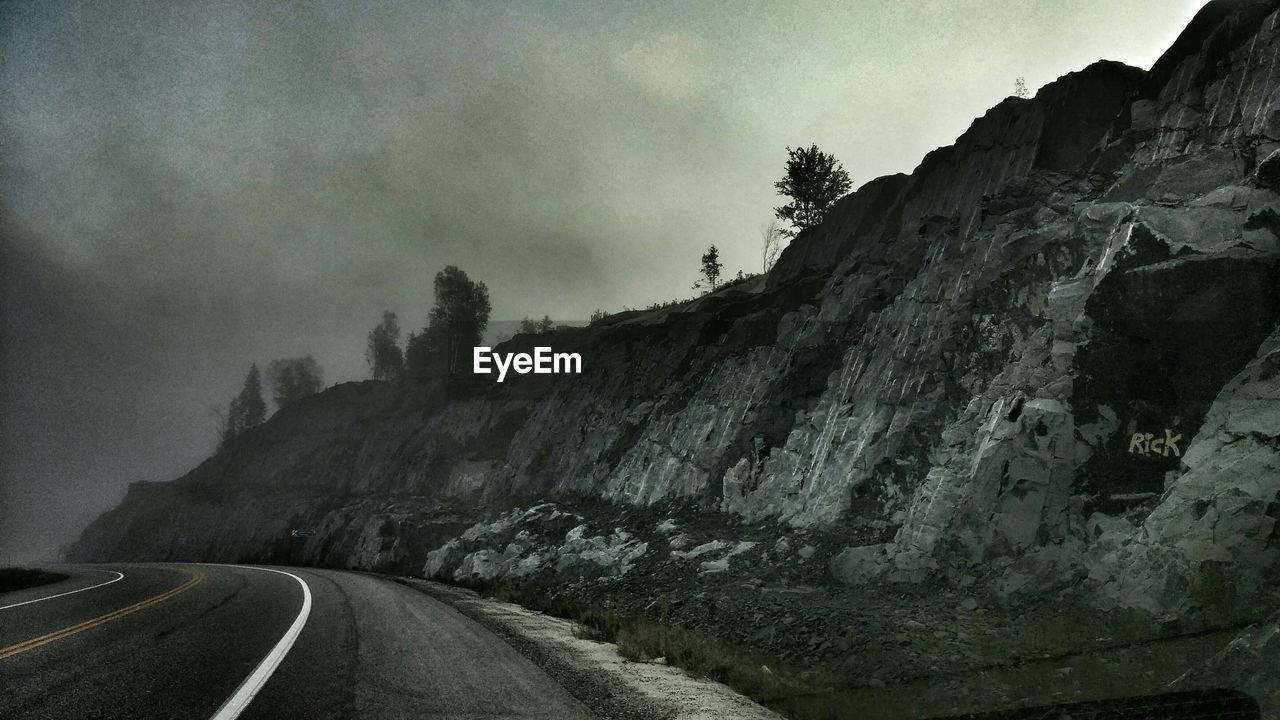 ROAD PASSING THROUGH MOUNTAINS