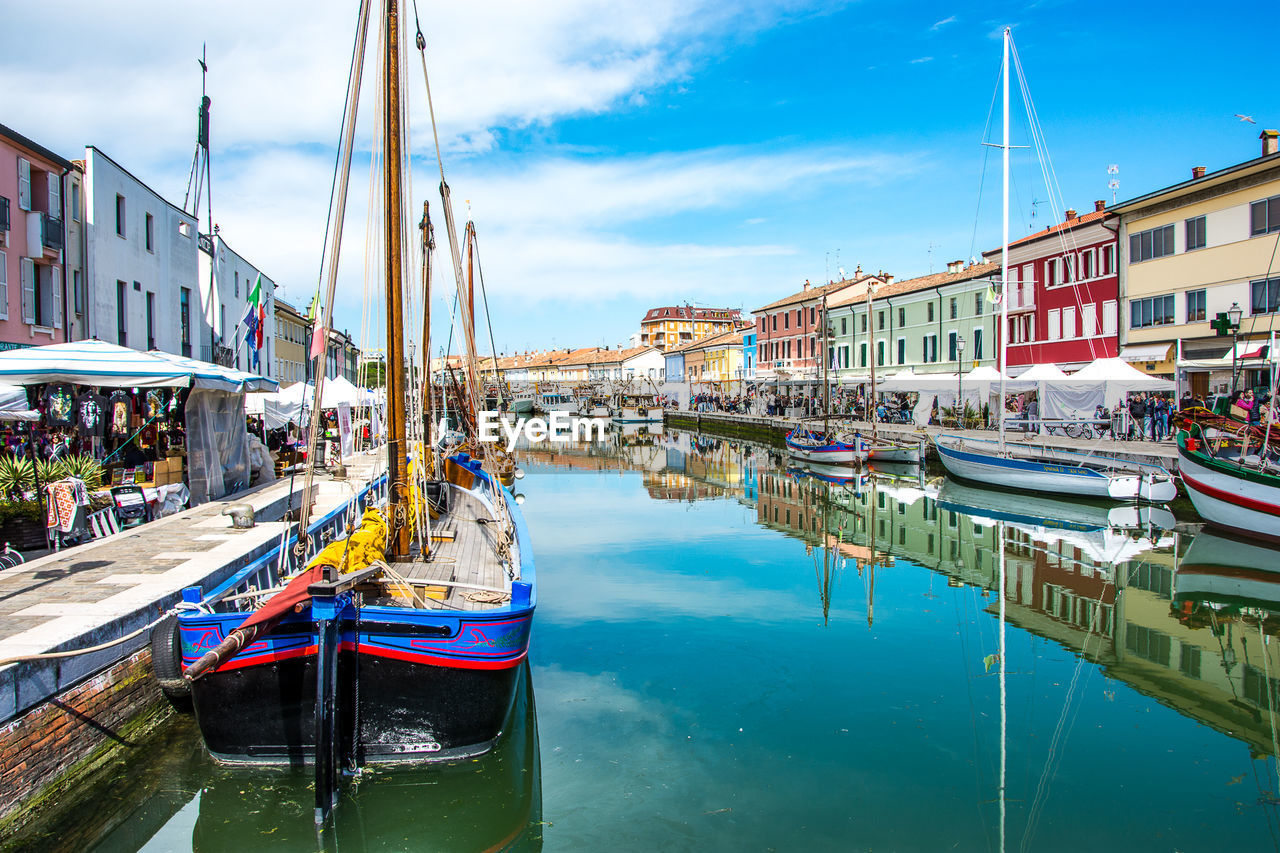 Boats moored at harbor