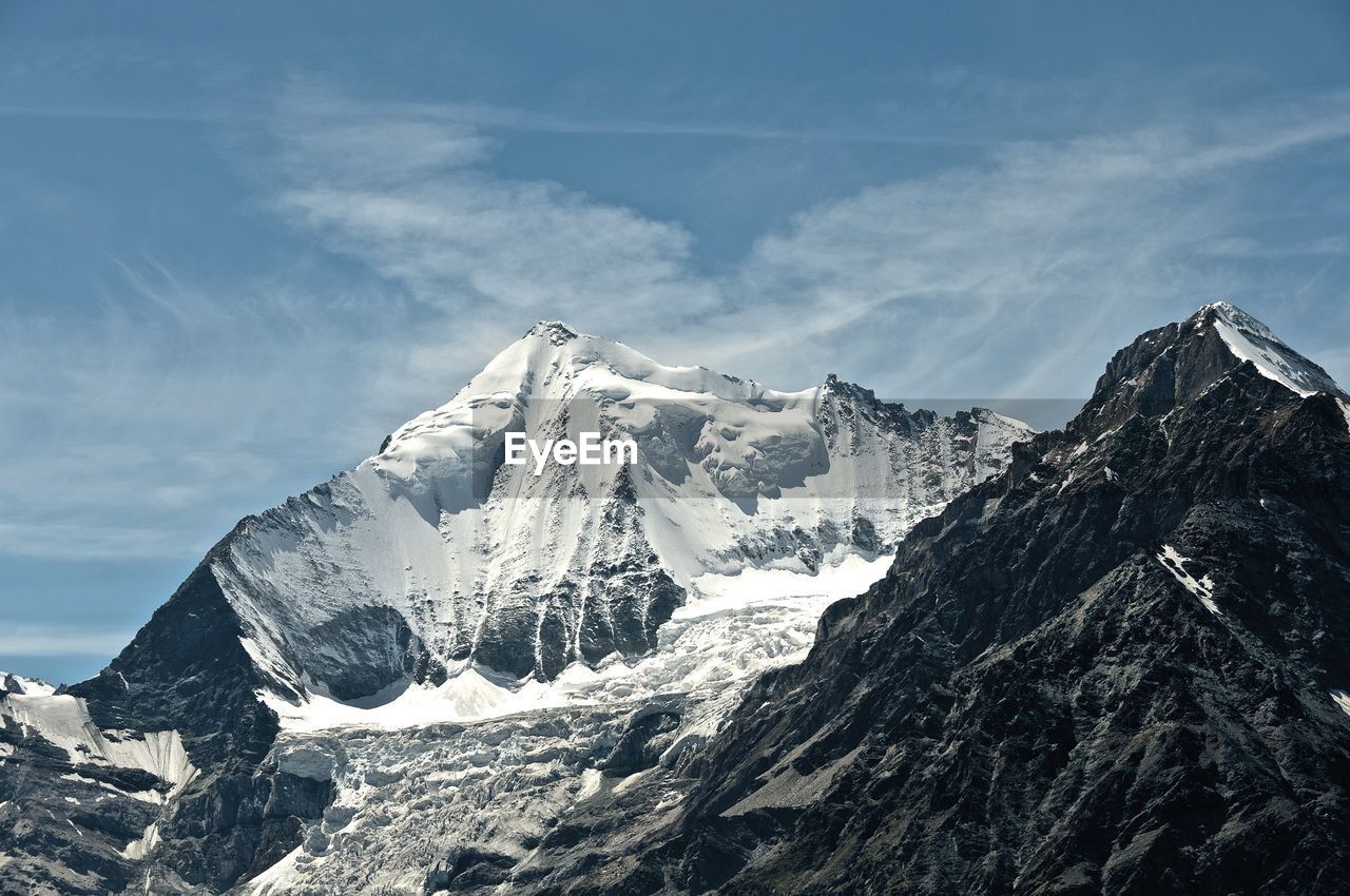 SNOWCAPPED MOUNTAINS AGAINST SKY