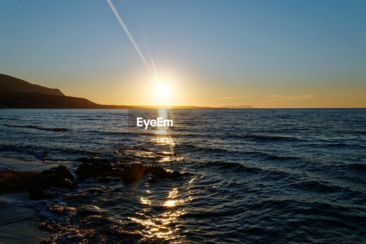 Scenic view of sea against sky during sunset