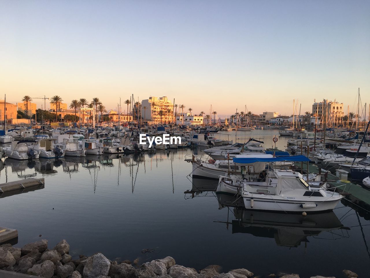 Boats moored at harbor