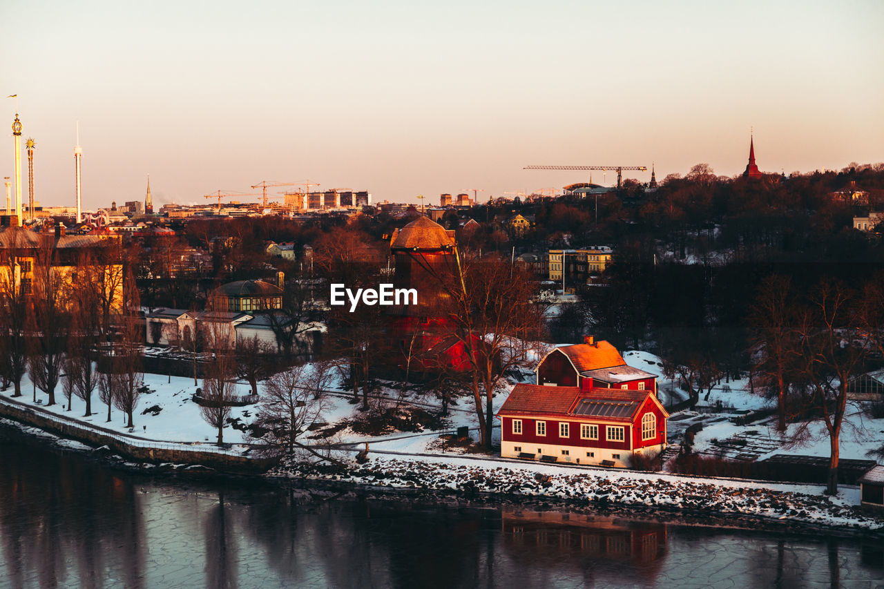 Aerial view of town by flowing river