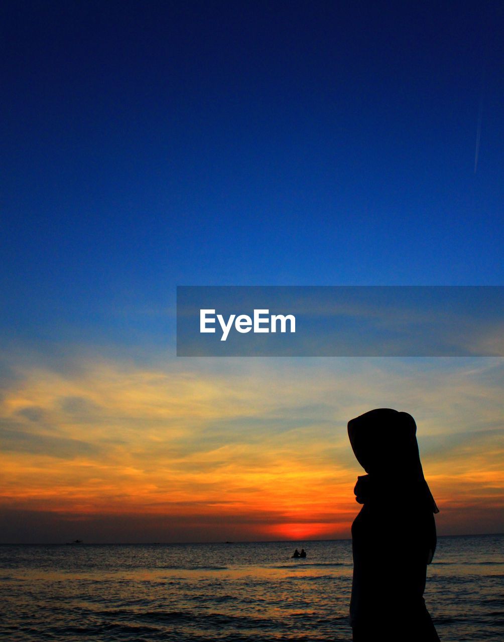 SILHOUETTE PERSON ON BEACH DURING SUNSET