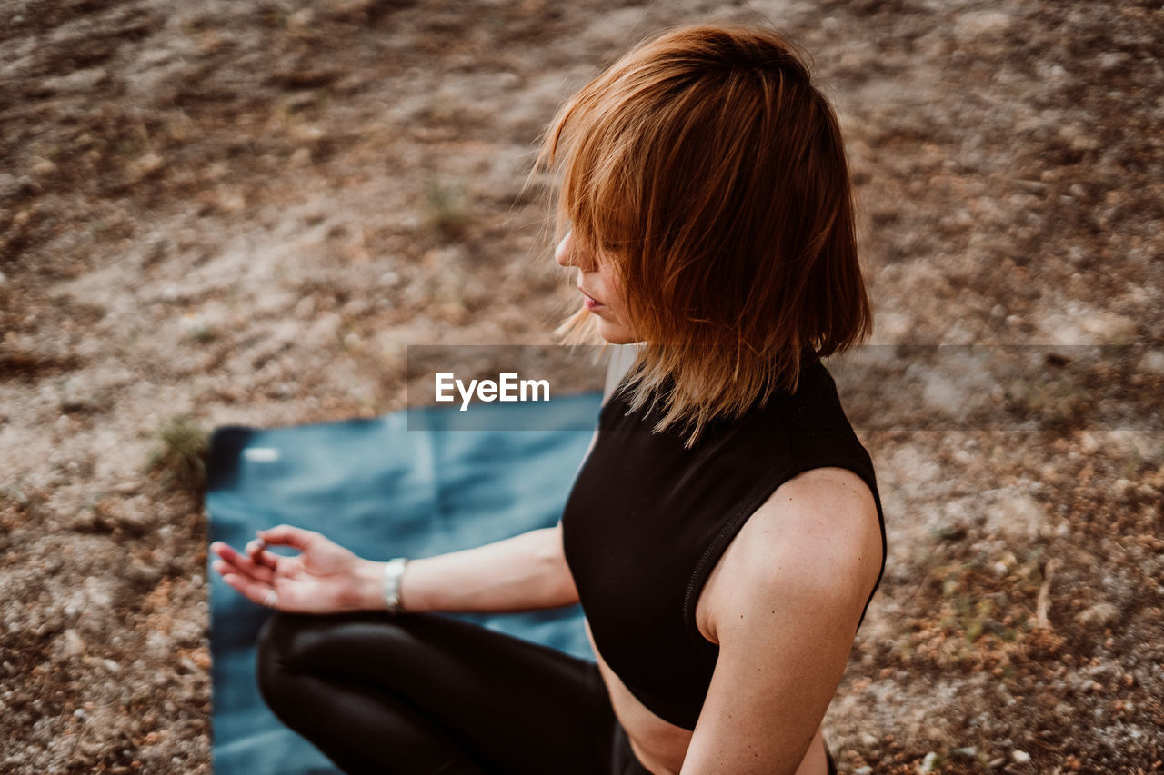 Woman meditating in park