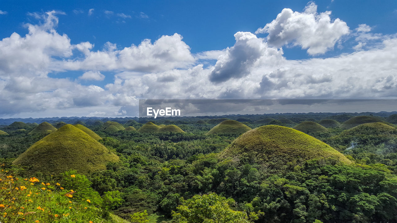 Scenic view of chocolate hills against sky