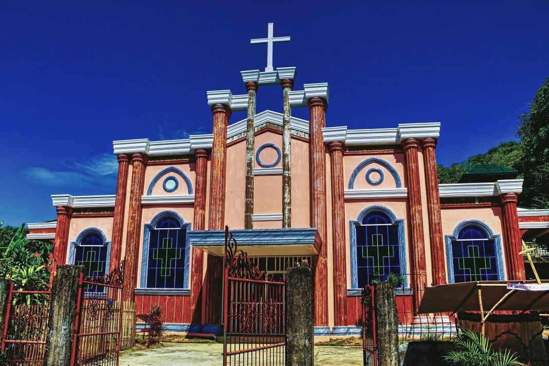 LOW ANGLE VIEW OF BUILT STRUCTURE WITH ARCHED STRUCTURE