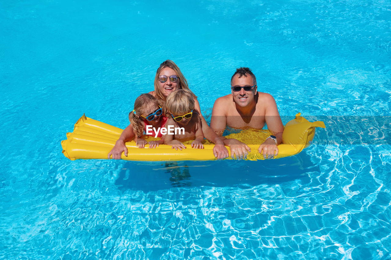 portrait of woman swimming in pool