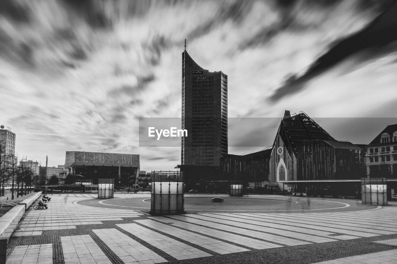 VIEW OF BUILDINGS AGAINST CLOUDY SKY