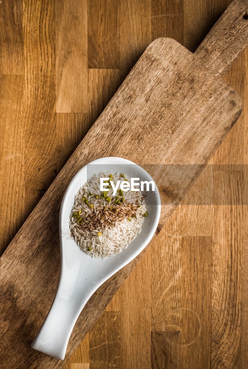 Directly above shot of food in spoon on cutting board