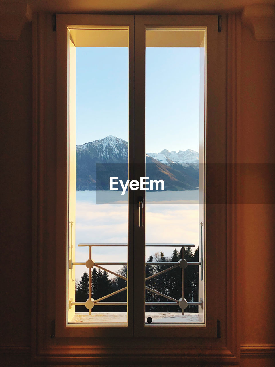 Scenic view of mountains seen through window