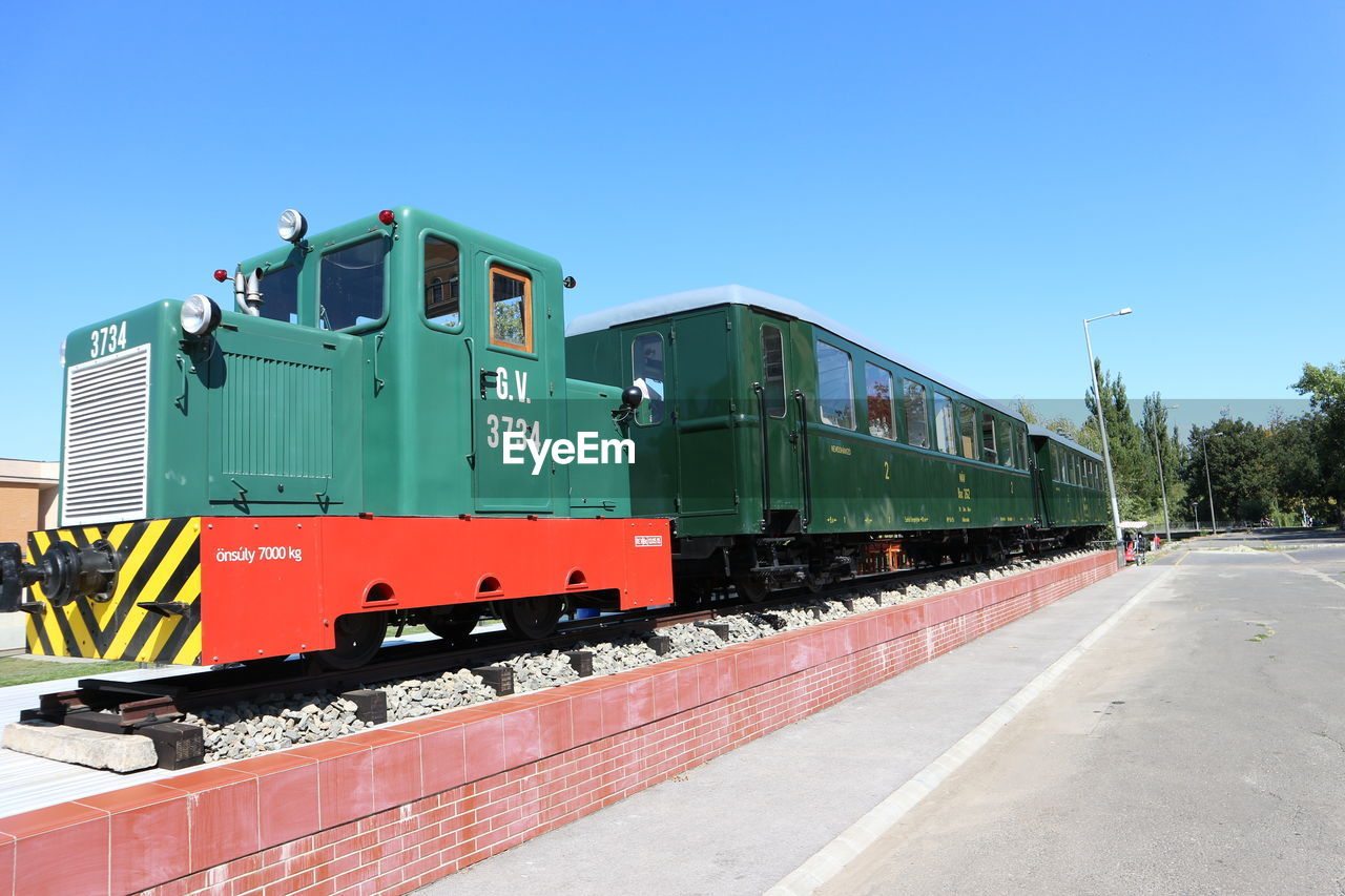 TRAIN ON RAILWAY STATION PLATFORM