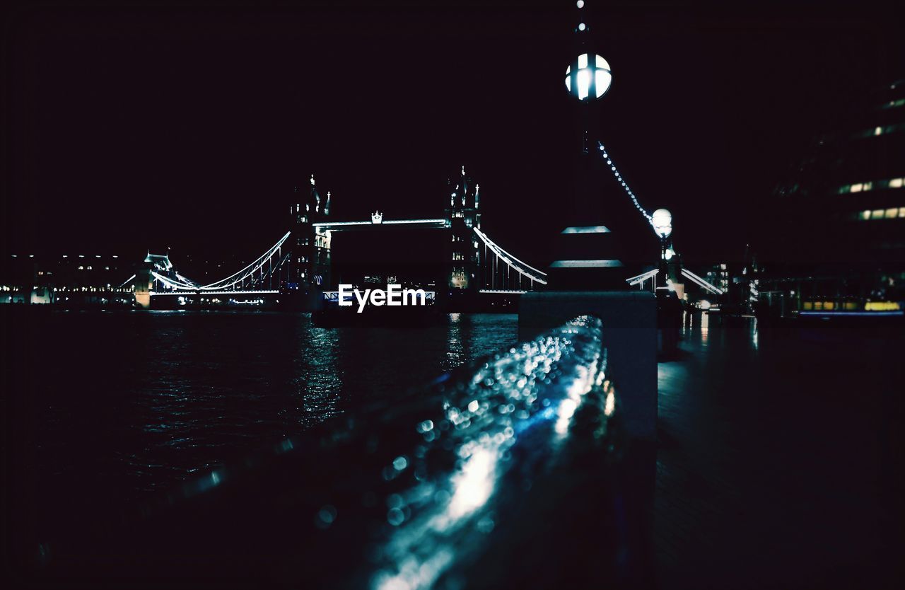 Illuminated tower bridge at night