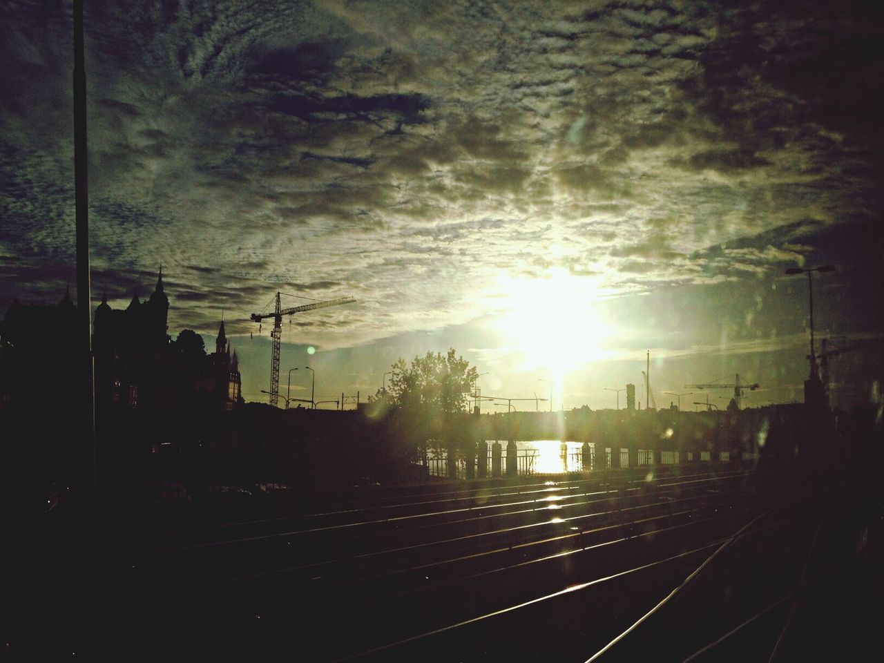 Railway tracks in the dark at sunset