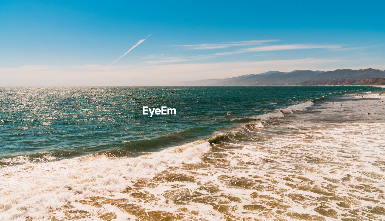 SCENIC VIEW OF BEACH AGAINST CLEAR SKY