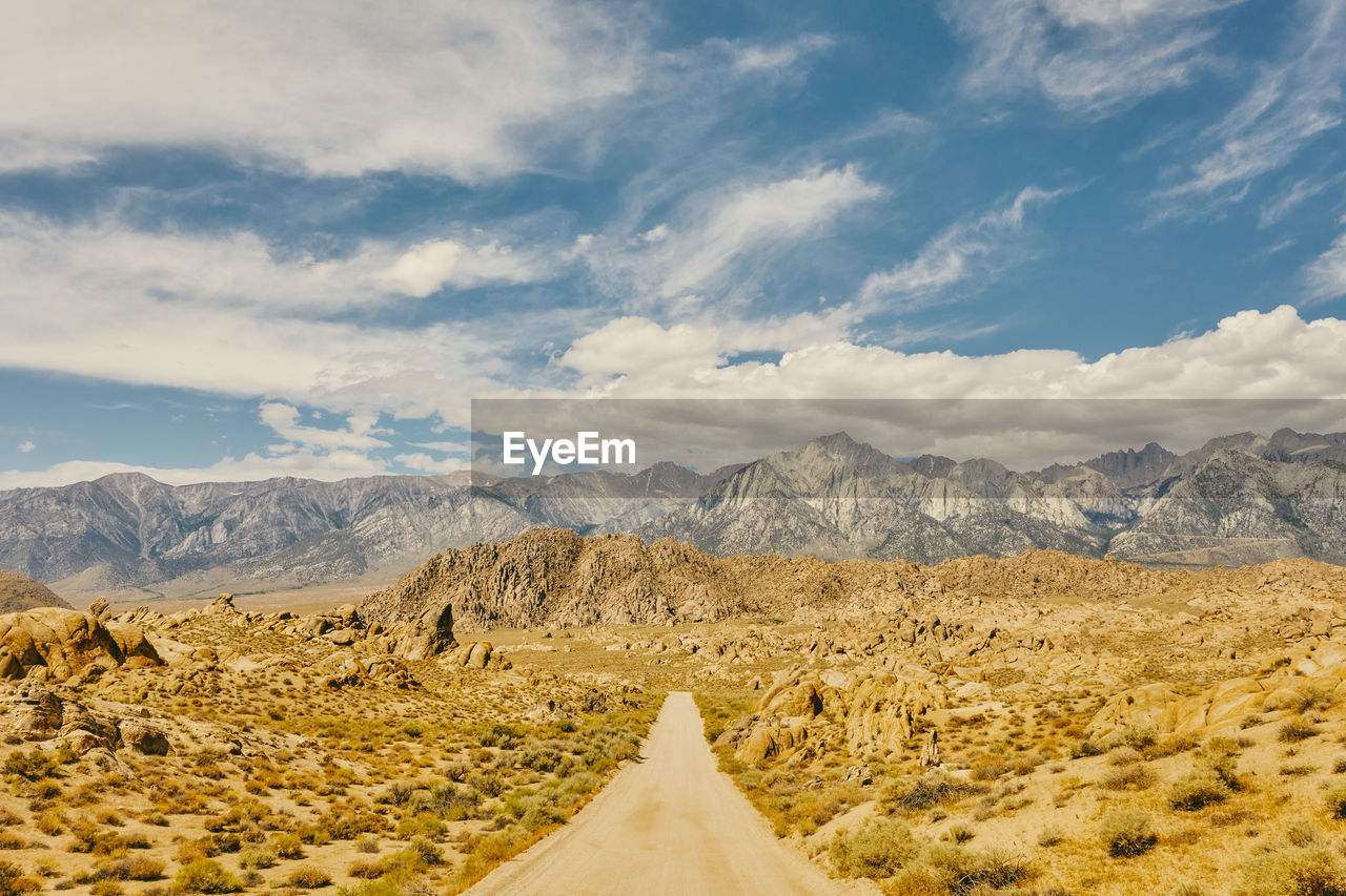 Deserted road near foothills of alabama hills in northern califonia.