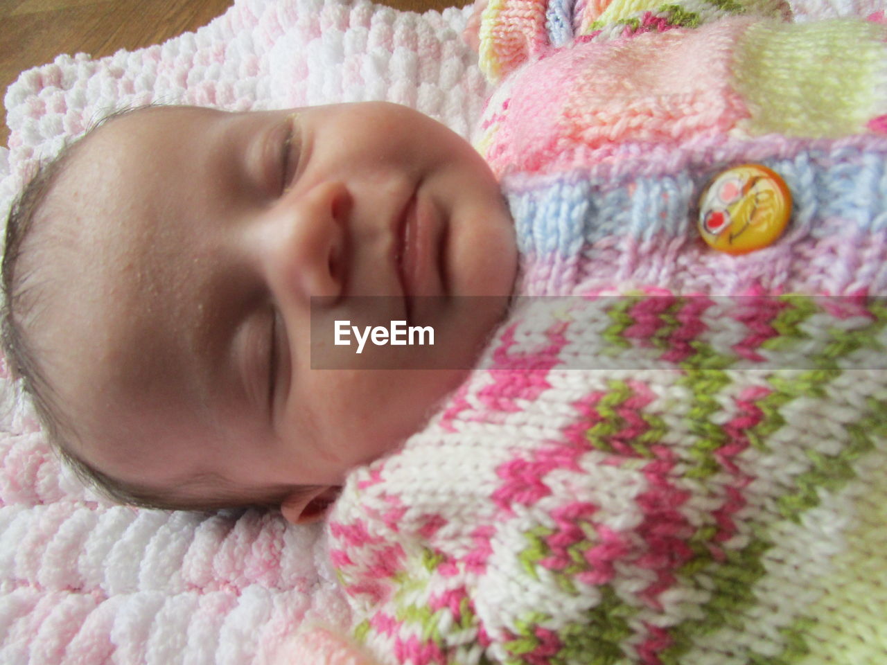 CLOSE-UP PORTRAIT OF CUTE BABY BOY SLEEPING ON BED