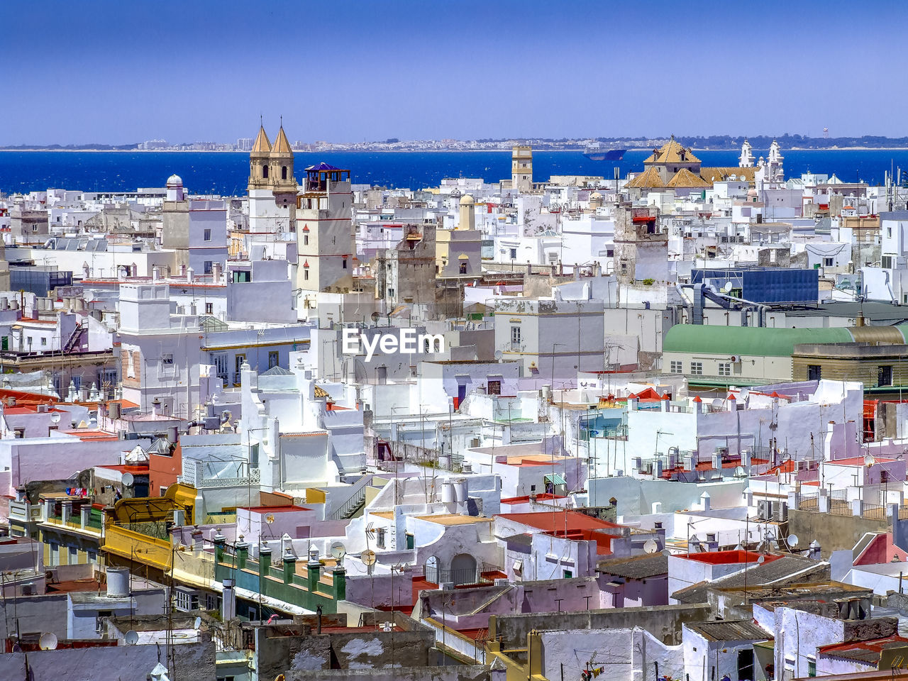 Cityscape against clear blue sky