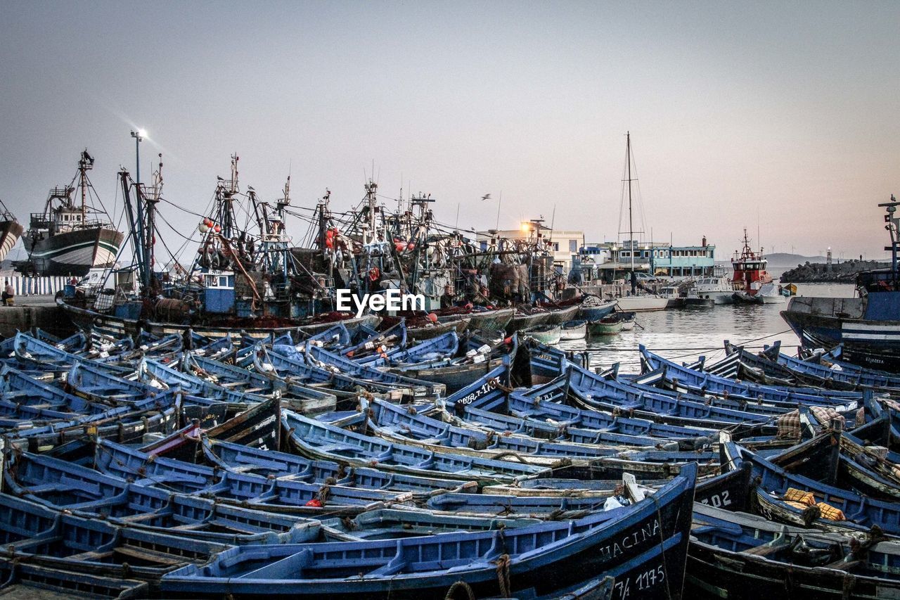 Fishing boats moored at harbor