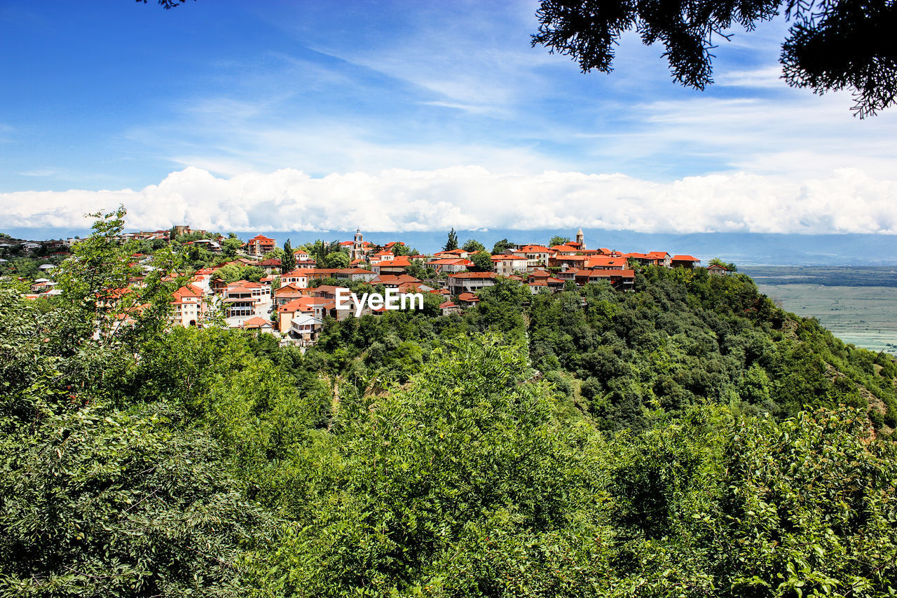 Panoramic view of townscape by sea against sky