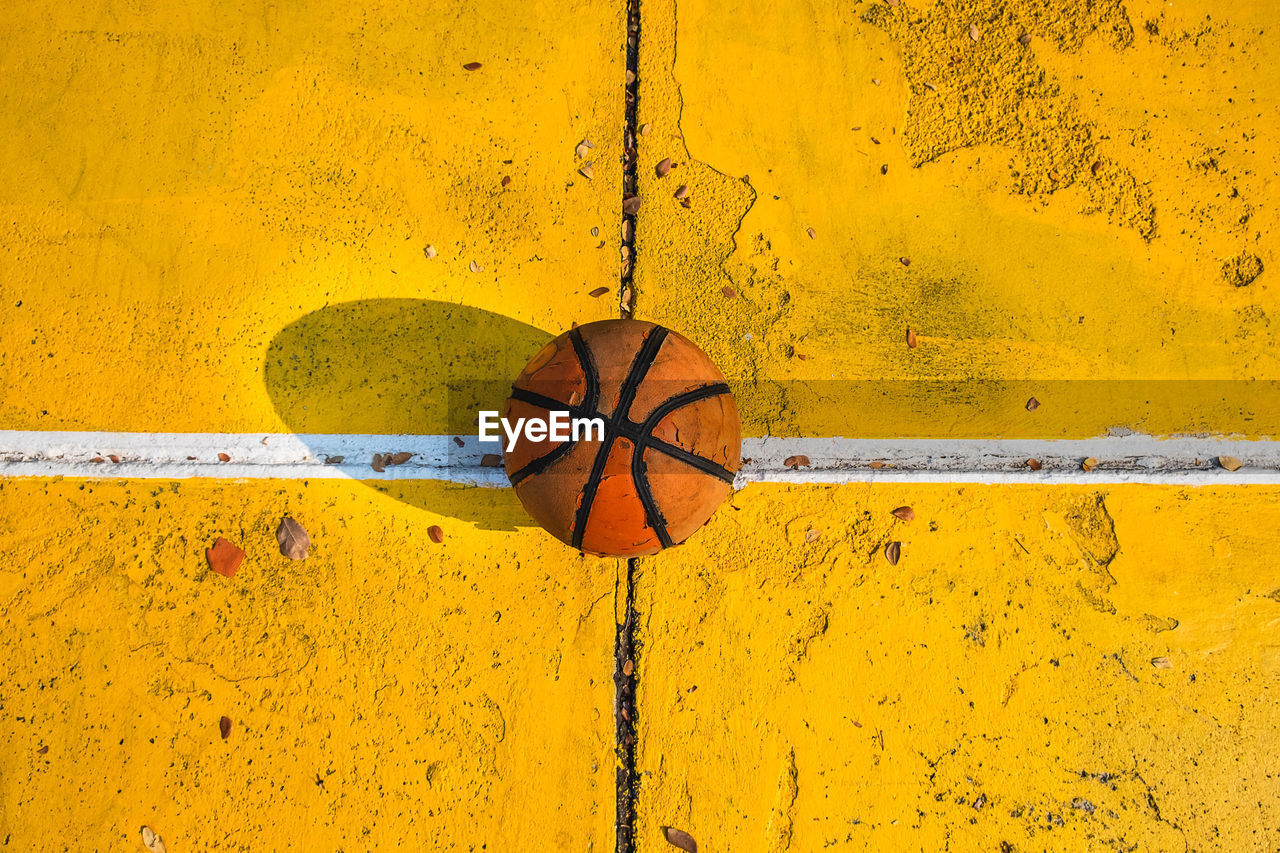 High angle view of basketball on footpath