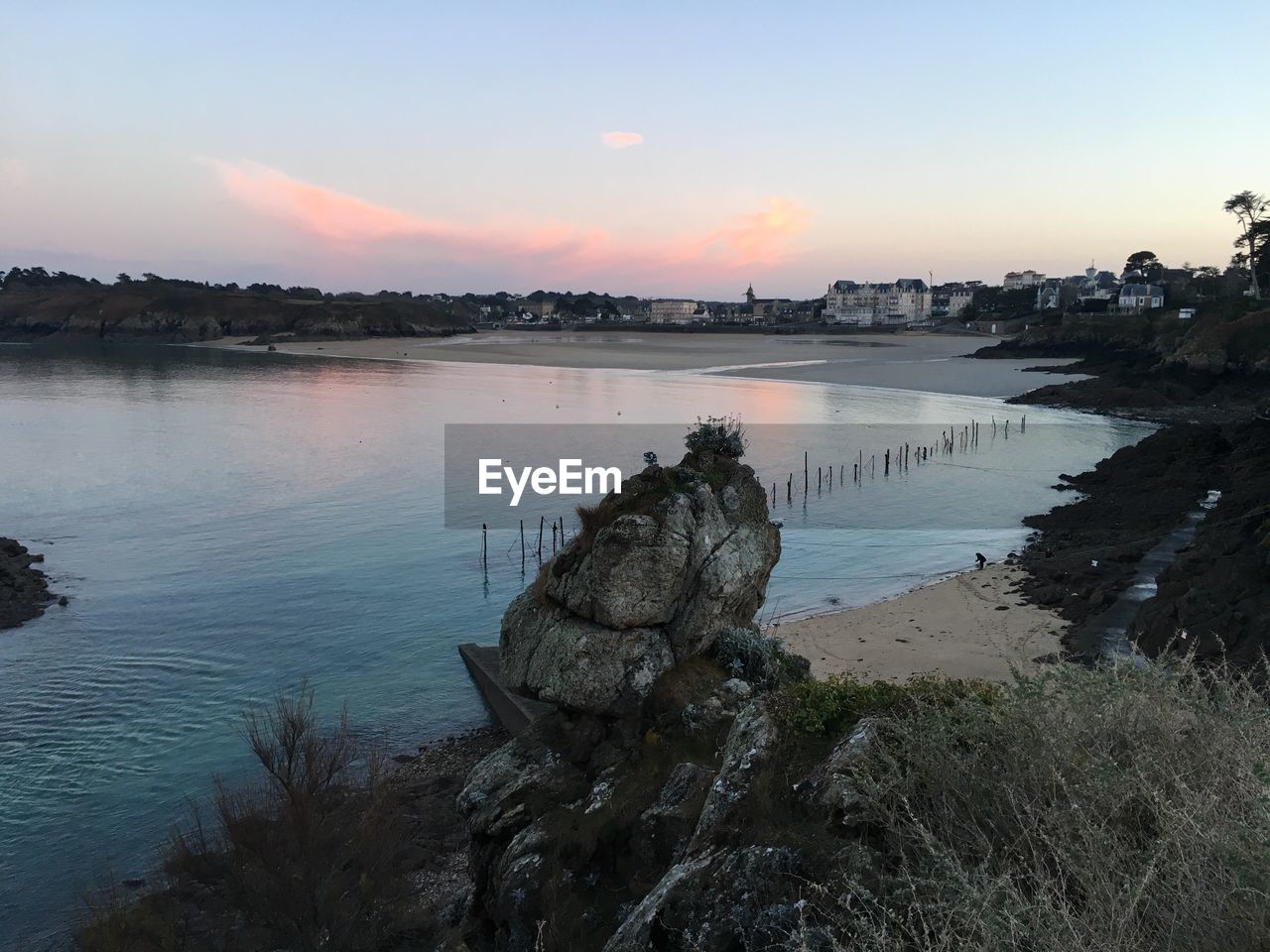 SCENIC VIEW OF LAKE AT SUNSET