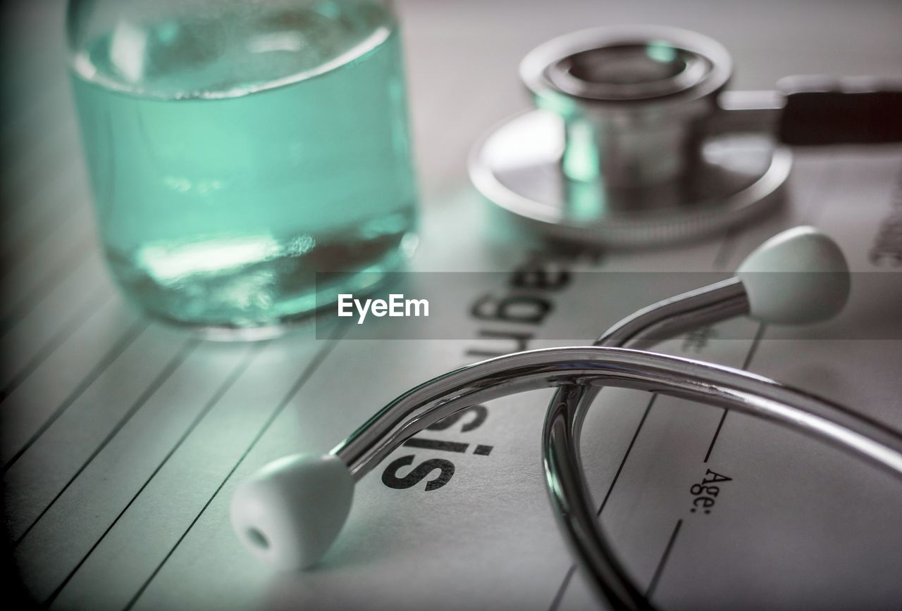 CLOSE-UP OF GLASSES ON TABLE