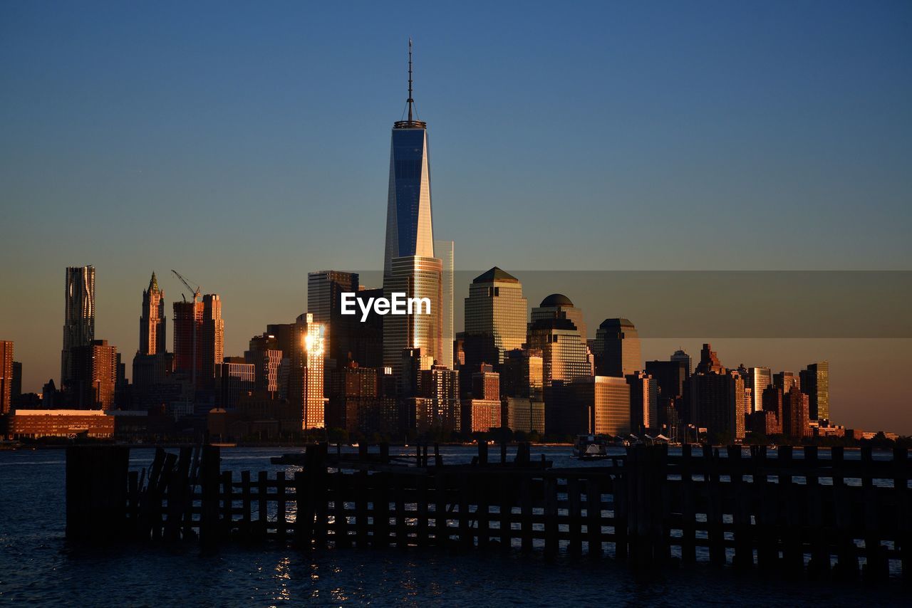 Modern buildings in city against clear sky