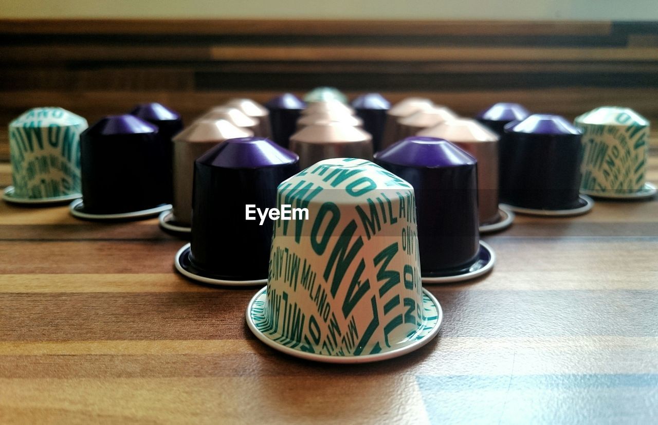 High angle view of coffee capsules arranged on table