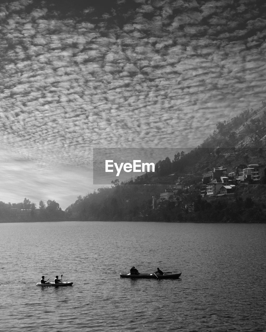 BOATS ON LAKE AGAINST SKY