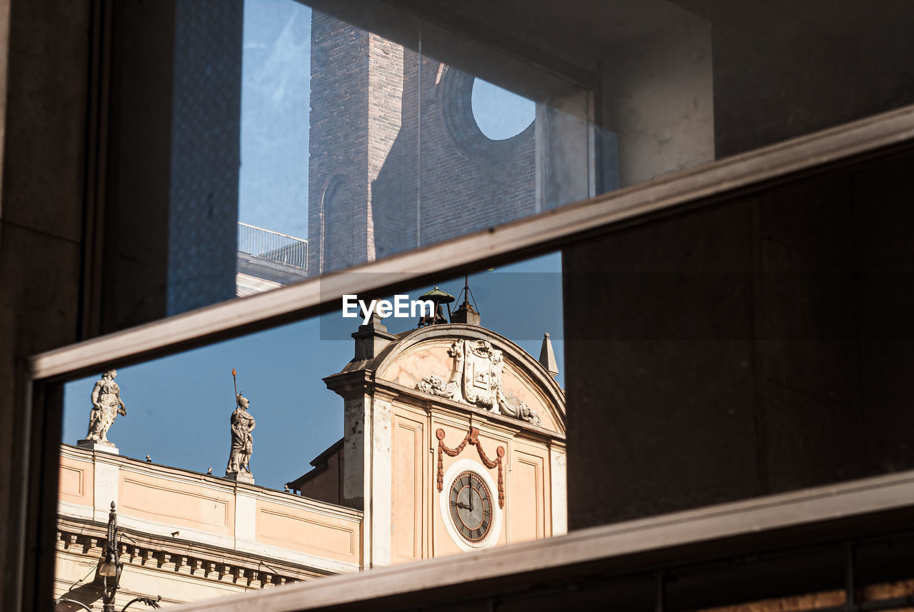 Window with reflection of church