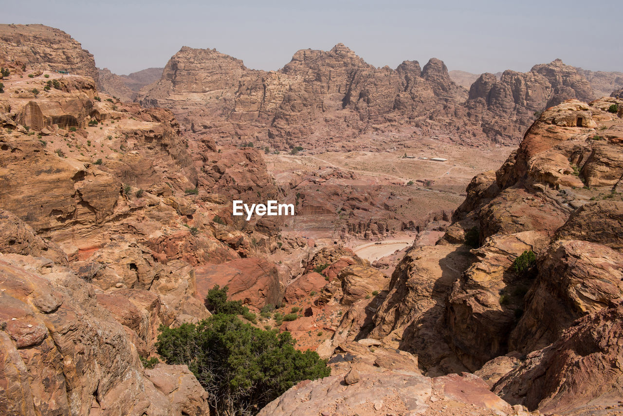 Scenic view of mountains against sky during sunny day